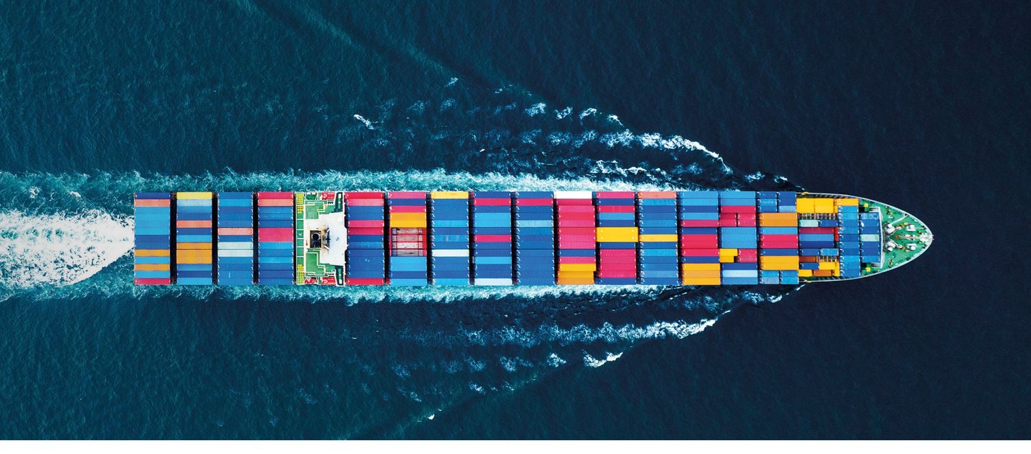 Aerial view of a fully loaded container vessel at sea